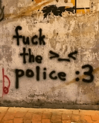 graffiti on a wall says fuck the police 3