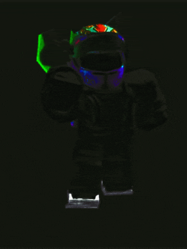 a robot is glowing in the dark and has a purple helmet on