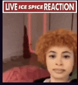 a woman with red hair is taking a selfie in front of a sign that says live ice spice reaction .