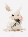 a white rabbit is holding a bouquet of pink flowers .