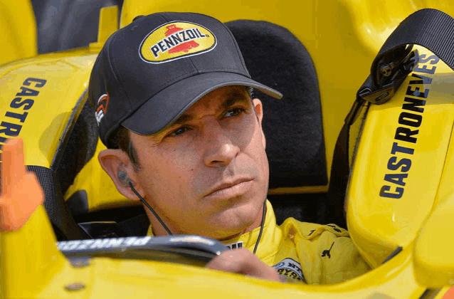 a man wearing a pennzoil hat is sitting in a yellow car