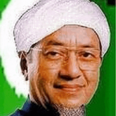 a close up of a man wearing glasses and a white turban on a green background .