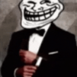 a troll in a tuxedo is holding a knife in his hand .