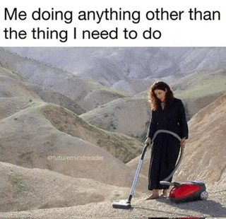 a woman is using a vacuum cleaner to clean a hillside