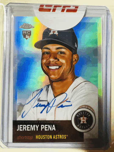 a baseball card signed by jeremy pena is in a clear case