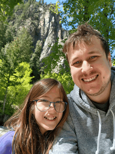 a man and a girl are posing for a picture