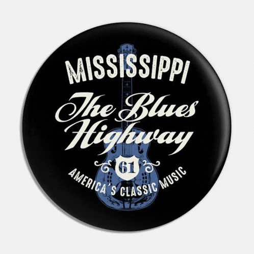 a mississippi the blues highway button with a guitar on it