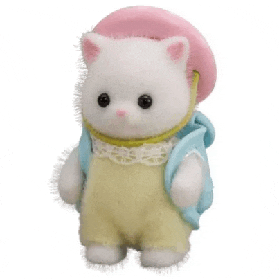 a white stuffed cat wearing a pink hat and overalls is standing next to a blue backpack .