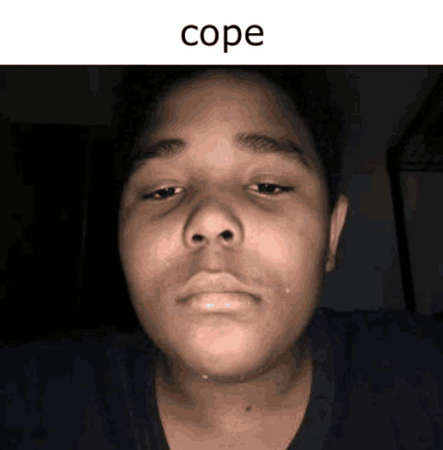 a close up of a person 's face with the word cope written above it .