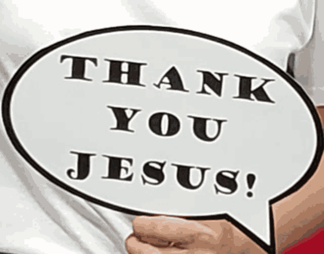 a person is holding up a sign that says thank you jesus