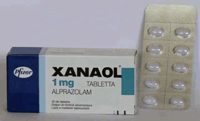 a box of xanaol 1 mg tablets sits next to a blister pack