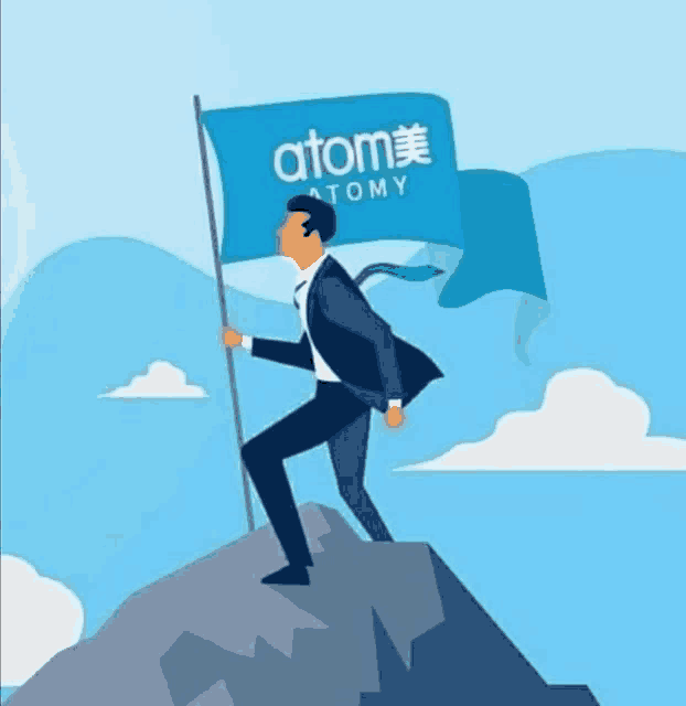 a man in a suit is holding a flag that says atomy