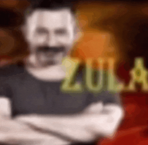 a blurred image of a man with the word zula in the background