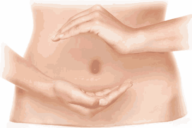 a woman 's stomach is shown with her hands around it