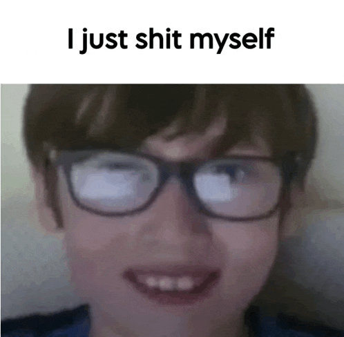 a young boy wearing glasses is smiling with the words `` i just shit myself '' below him .