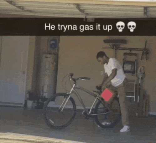 a man is standing next to a bicycle in a garage with the words he tryna gas it up above him