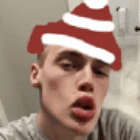 a man wearing a santa hat on his head .