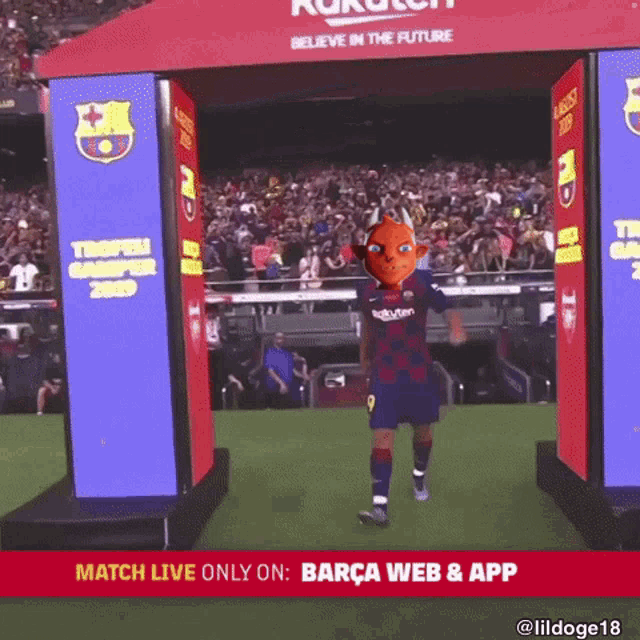 a soccer player stands in front of a banner that says match live only on barça web and app