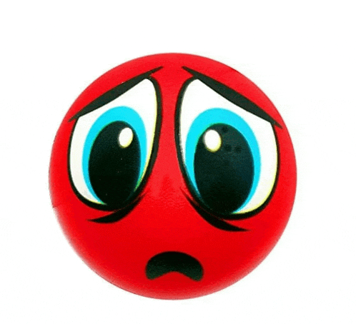 a red ball with a sad face on it .