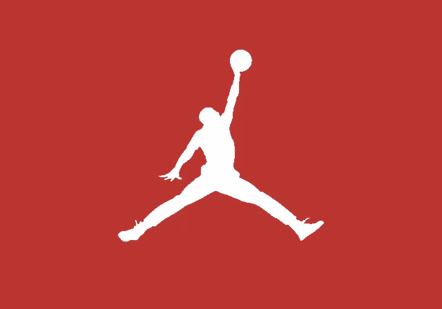 a silhouette of a man holding a basketball in his hand on a red background