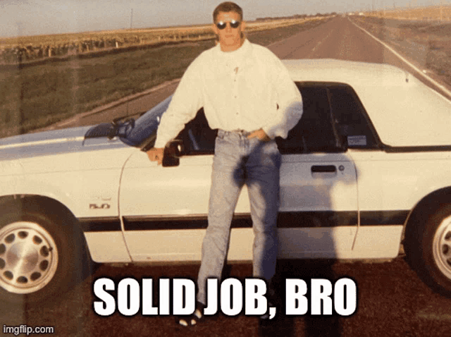 a man standing next to a white car that says solid job bro on it