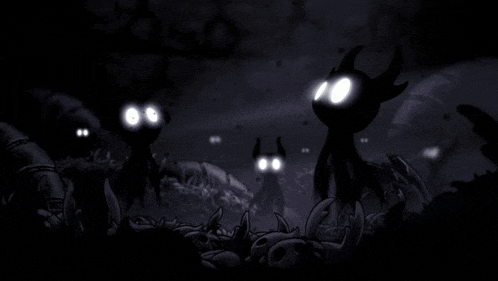 a group of cartoon characters with glowing eyes in the dark .