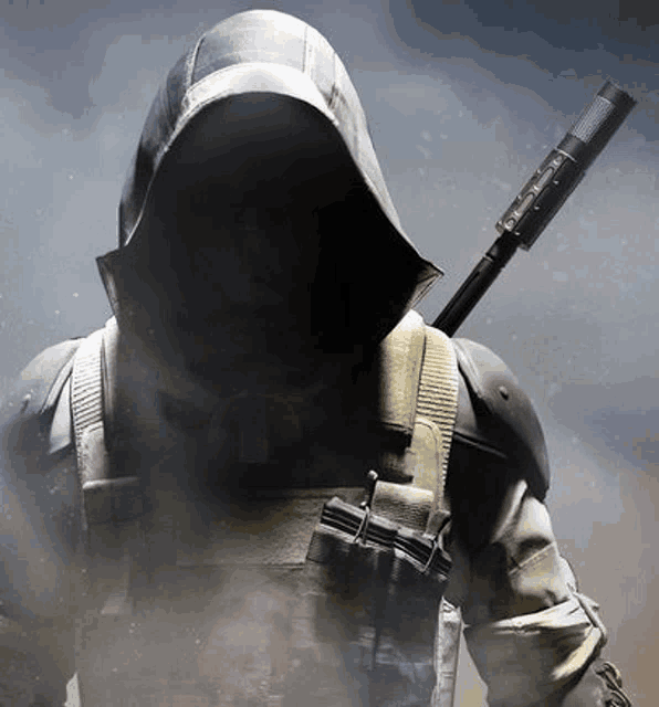 a man in a hooded jacket is holding a rifle .