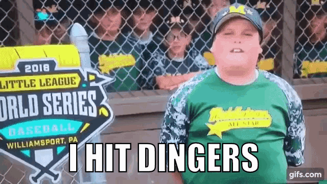 a boy in a green shirt is standing in front of a sign that says little league world series baseball .