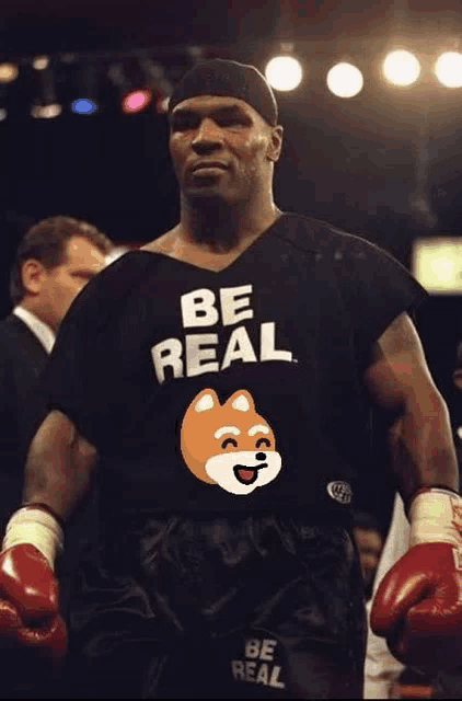 a boxer wears a black shirt that says be real