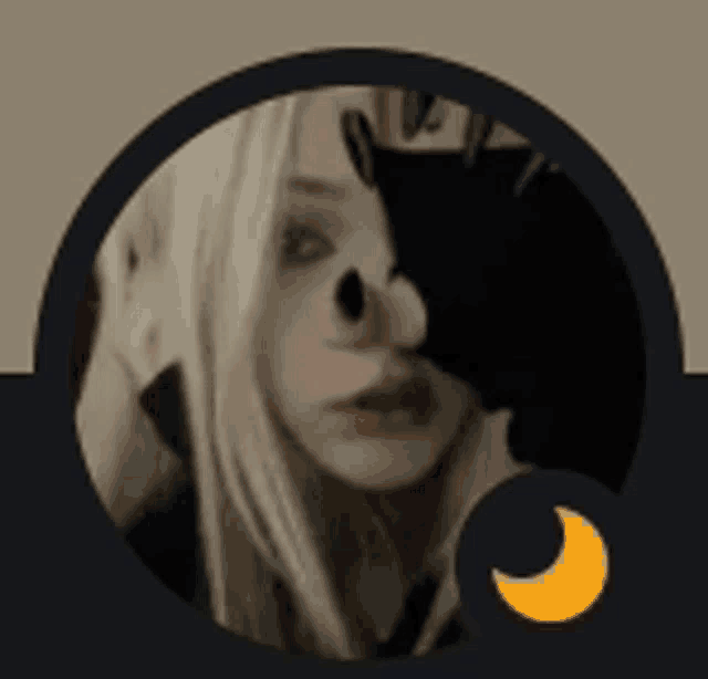 a woman 's face is covered by a black circle with a crescent moon in the corner