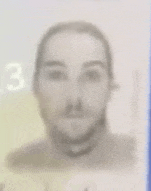 a blurry picture of a man 's face with the number 3 in the corner .