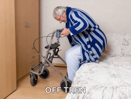 an elderly man is sitting on a bed using a walker and the word off tren is above him