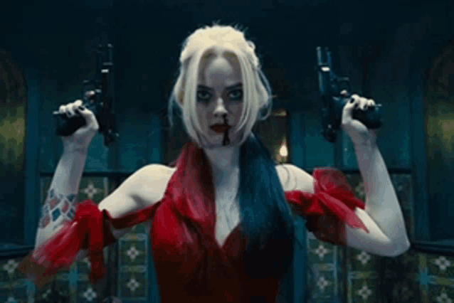 harley quinn is holding two guns in her hands