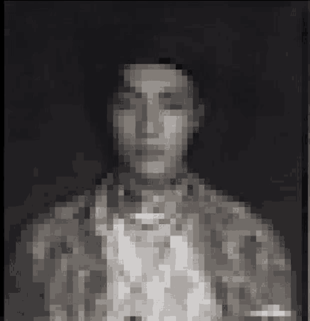 a pixelated image of a man 's face with a black background