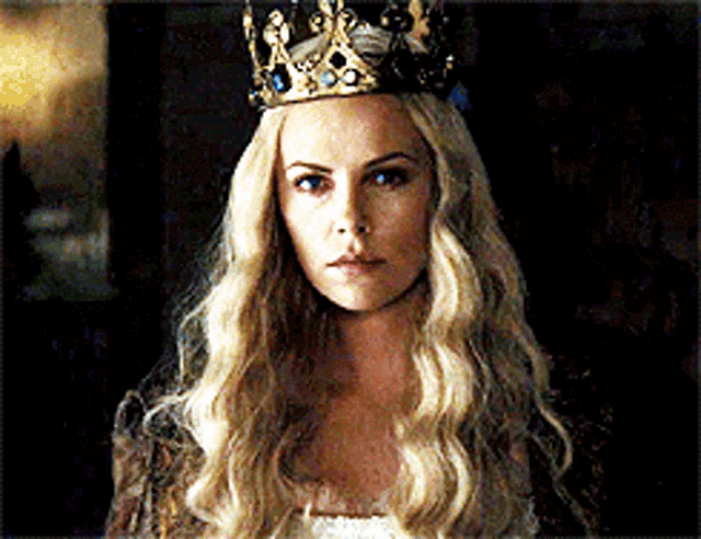 a woman with long blonde hair wearing a crown on her head