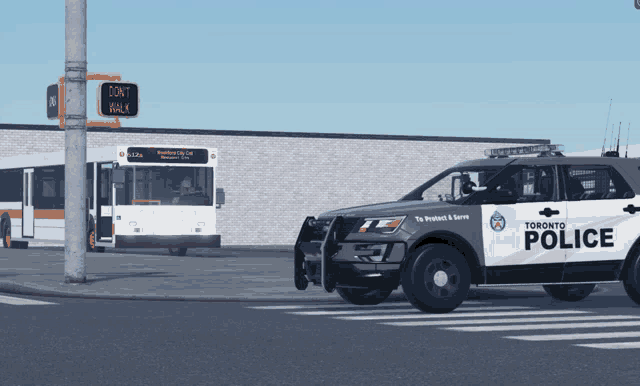 a toronto police car is parked in front of a sign that says do n't walk