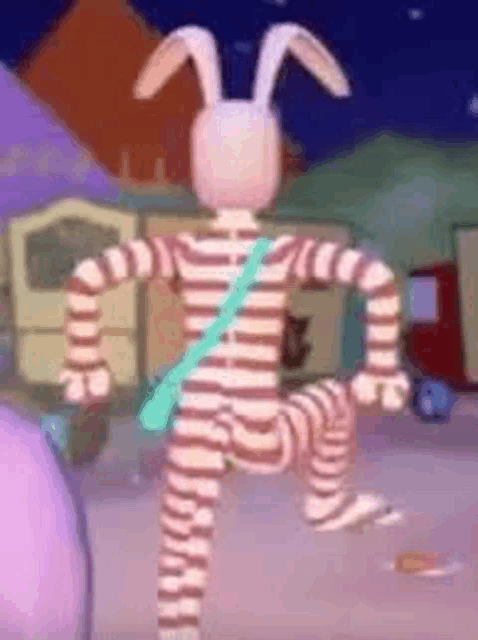 a cartoon rabbit is standing on one leg in a striped outfit .