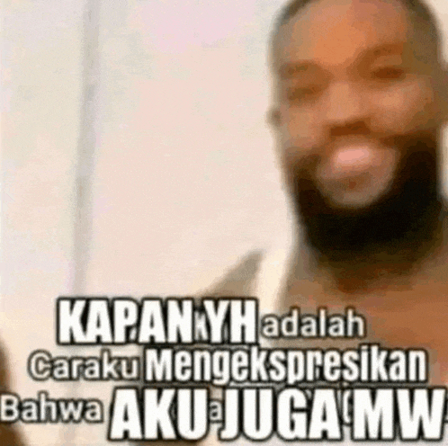 a man with a beard is making a funny face with a caption that says kapanyh adalah