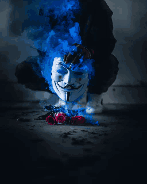 a anonymous mask is surrounded by blue smoke and roses