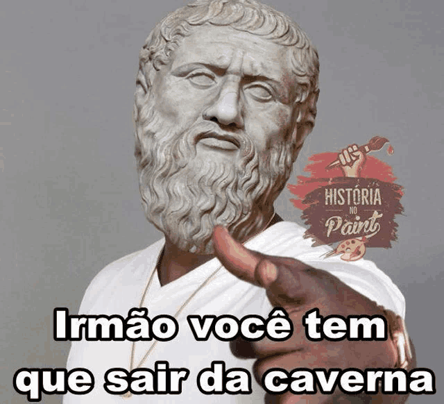 a statue of a man with a beard pointing at the camera with the words irmao você tem que sair da caverna below him