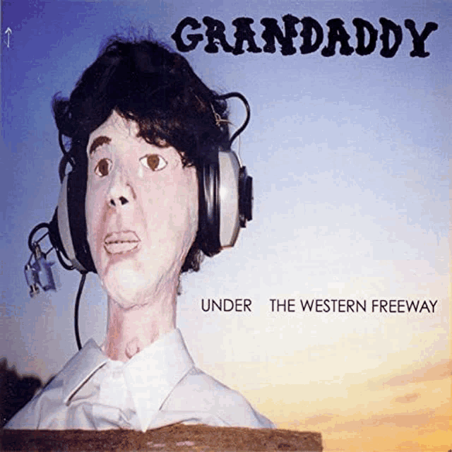 a statue of a man wearing headphones is on the cover of granddaddy under the western freeway