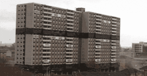 a black and white photo of a very tall building that says ' a ' on the top