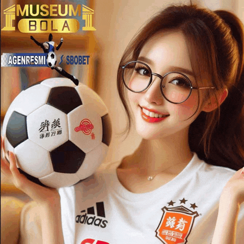 a woman wearing glasses holds a soccer ball in front of a museum bola ad