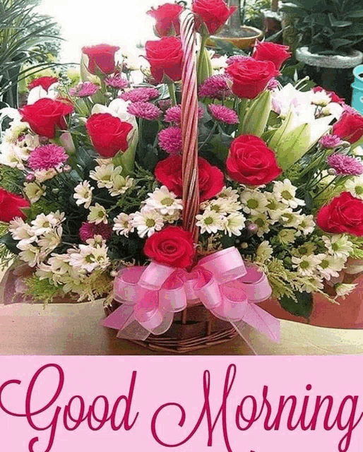 a bouquet of flowers in a basket with the words " good morning "