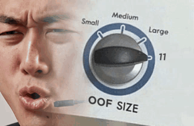 a man is making a face in front of a washer and dryer that says oof size on it