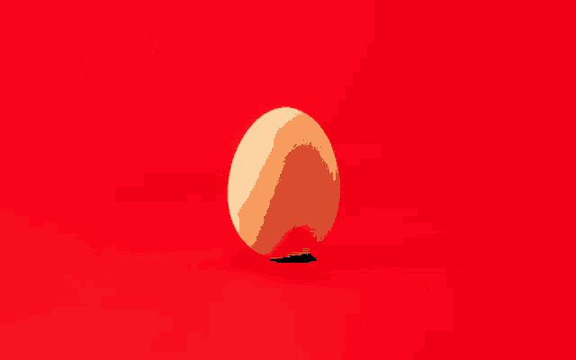 a single egg is on a red surface