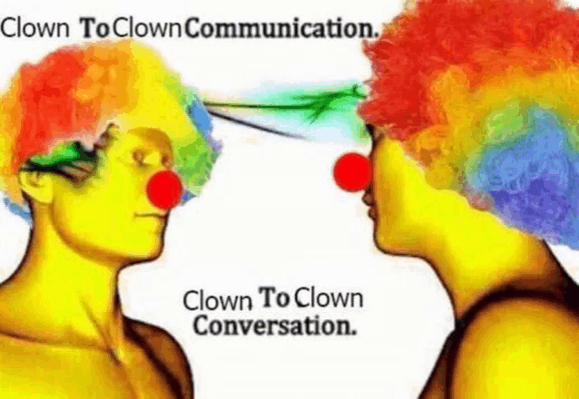 two clowns with red noses are looking at each other and talking to each other .