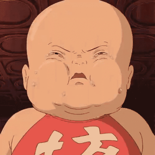 a bald baby is crying and wearing a red shirt with chinese characters .