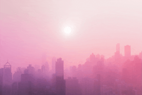 a city skyline with a pink sky and the sun shining through the clouds