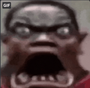 a close up of a man 's face with his mouth open and a gif button in the corner